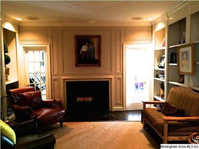 Living room with built-ins and fireplace