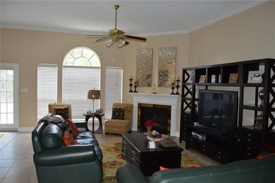 Spacious Den with fireplace and plenty of natural
