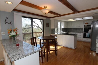 Eat in Kitchen with slider to deck overlooking yar