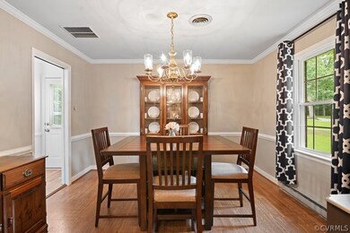 Formal Dining Room with hardwood floors, moldings,