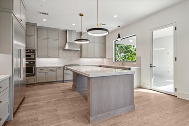 Closer view of kitchen and  breakfast bar. Thermad