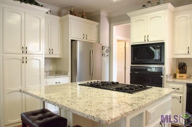 Island seating, breakfast dining area and office closet