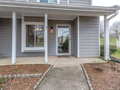 Covered front porch, glass storm door.