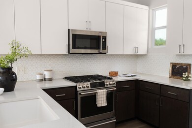 Kitchen with stainless steel appliances, light co