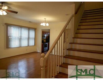 Living Room. hardwood floors with stairs leading u