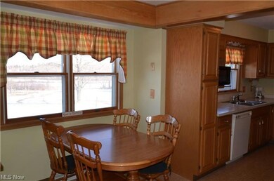 Dinette/Kitchen with backyard and pond views.