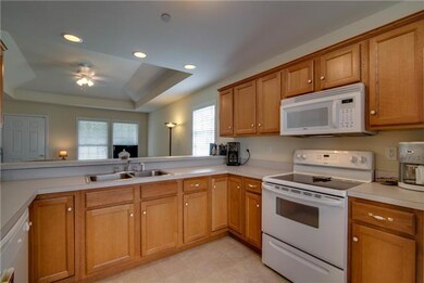 Kitchen offers tons of cabinets, smooth top stove, Fridge to convey with home