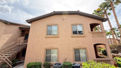 Back of house with central AC unit, stairs, and st