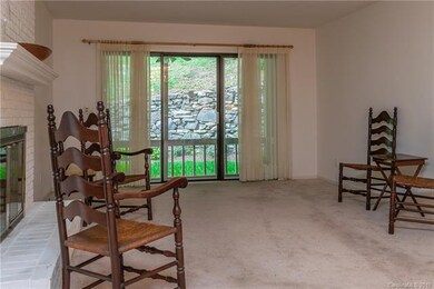Living Room with view of screened porch and back yard