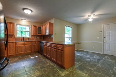 The kitchen is large and spacious and has custom cabinets!