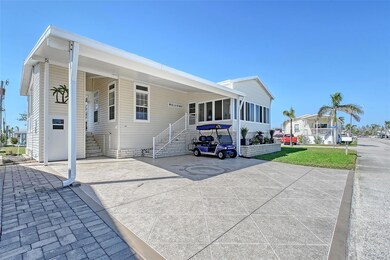 Open air lanai beyond the carport & storage area