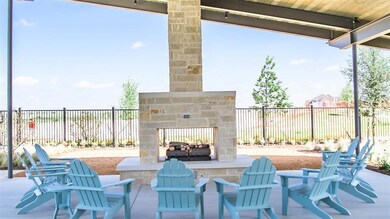 View of patio / terrace with an outdoor stone fire