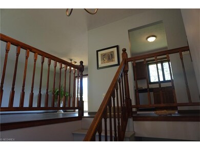 Bright and open foyer leads up to a large living/d