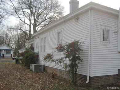 Vinyl sided, and brick foundation.
