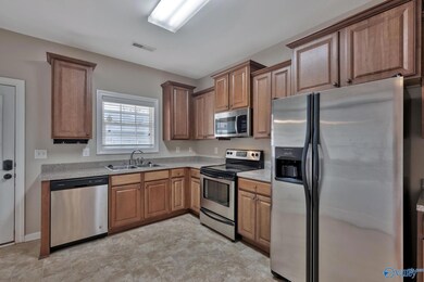 AMPLE KITCHEN WITH STAINLESS STEEL APPLIANCES. THE REFRIGERATOR IS YOURS!!