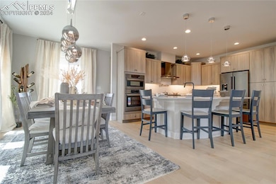 Dining space featuring light wood-type flooring