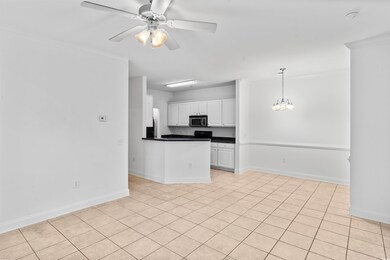 Kitchen featuring light tile patterned flooring, w