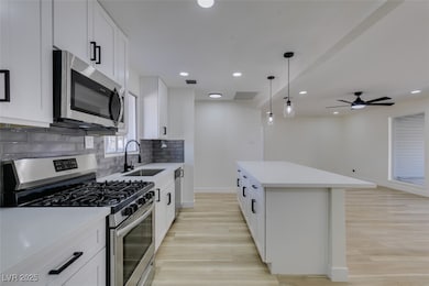 Kitchen with light wood-style flooring, visible ve