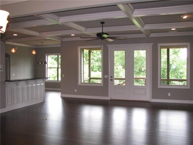 Open living room with coffered ceiling's & beautiful bamboo flooring