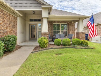 Doorway to property with a lawn
