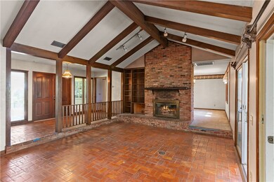 View of front door, foyer, family room and side en