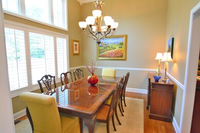 Elegant dining room with soaring ceiling