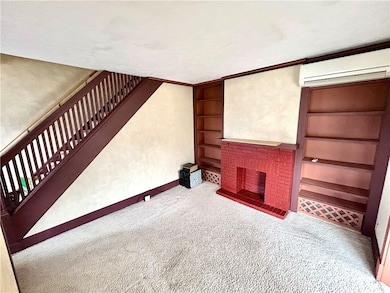 Nice living room.  The staircase has original wood