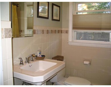 Bathroom. updated bath with pretty accented tiles