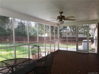 REAR SCREENED PORCH WITH PATIO TABLE AND CHAIRS, P