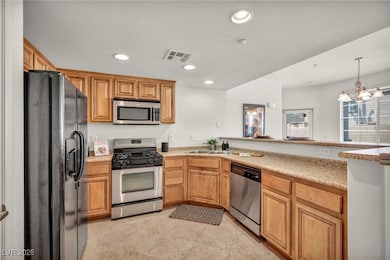 Kitchen with appliances with stainless steel finis