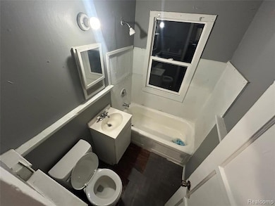 Bathroom featuring vanity and shower / washtub combination