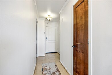 The foyer welcomes you with elegant crown moulding