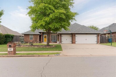 Single story home featuring a front yard and a gar