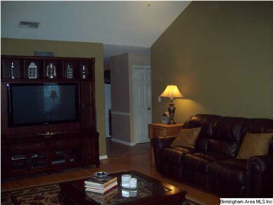 Spacious Family Room offers Hardwood Floors, soari