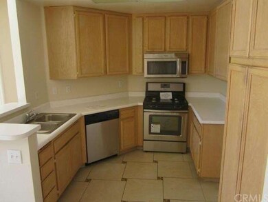 Light, bright kitchen with stainless steel applian