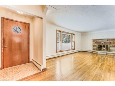 Front Entry/foyer into living room with WBFP