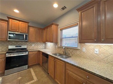 Kitchen with a sink, appliances with stainless ste