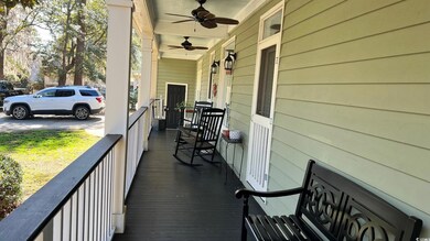 Wooden deck with ceiling fan and a porch