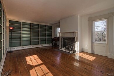 Wide plank floors, built-in book shelves, wood bur