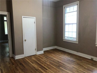 Empty room featuring dark wood finished floors and
