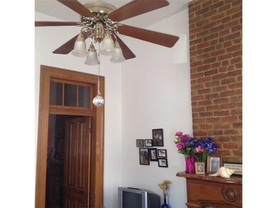 Living Room. High ceilings, nice woodwork & old details