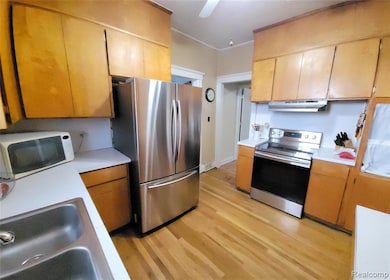 Kitchen featuring stainless steel appliances and hardwood floors