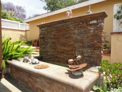Charming water feature in rear garden