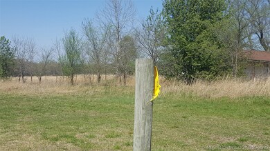 West most property line by the road