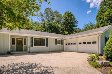 Driveway is sloped, but the top is flat for guest parking or ease of turnaround.