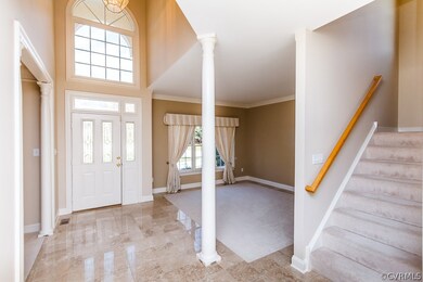 Grand Two Story Foyer w/ Marble Floors.