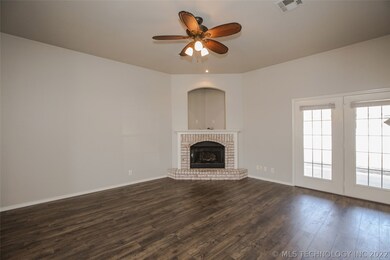 Large Family Room features fireplace with gas logs