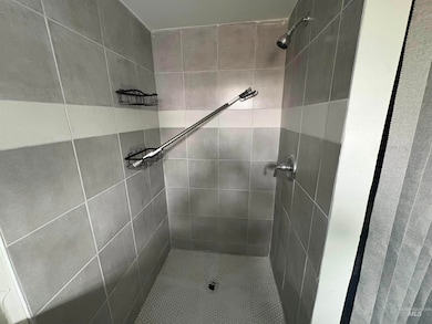Full bathroom with a shower stall
