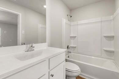 Adjacent primary bathroom with a walk-in closet!