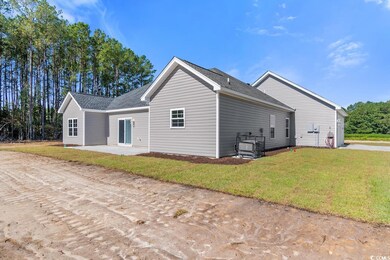 View of home's exterior featuring a yard and a pat